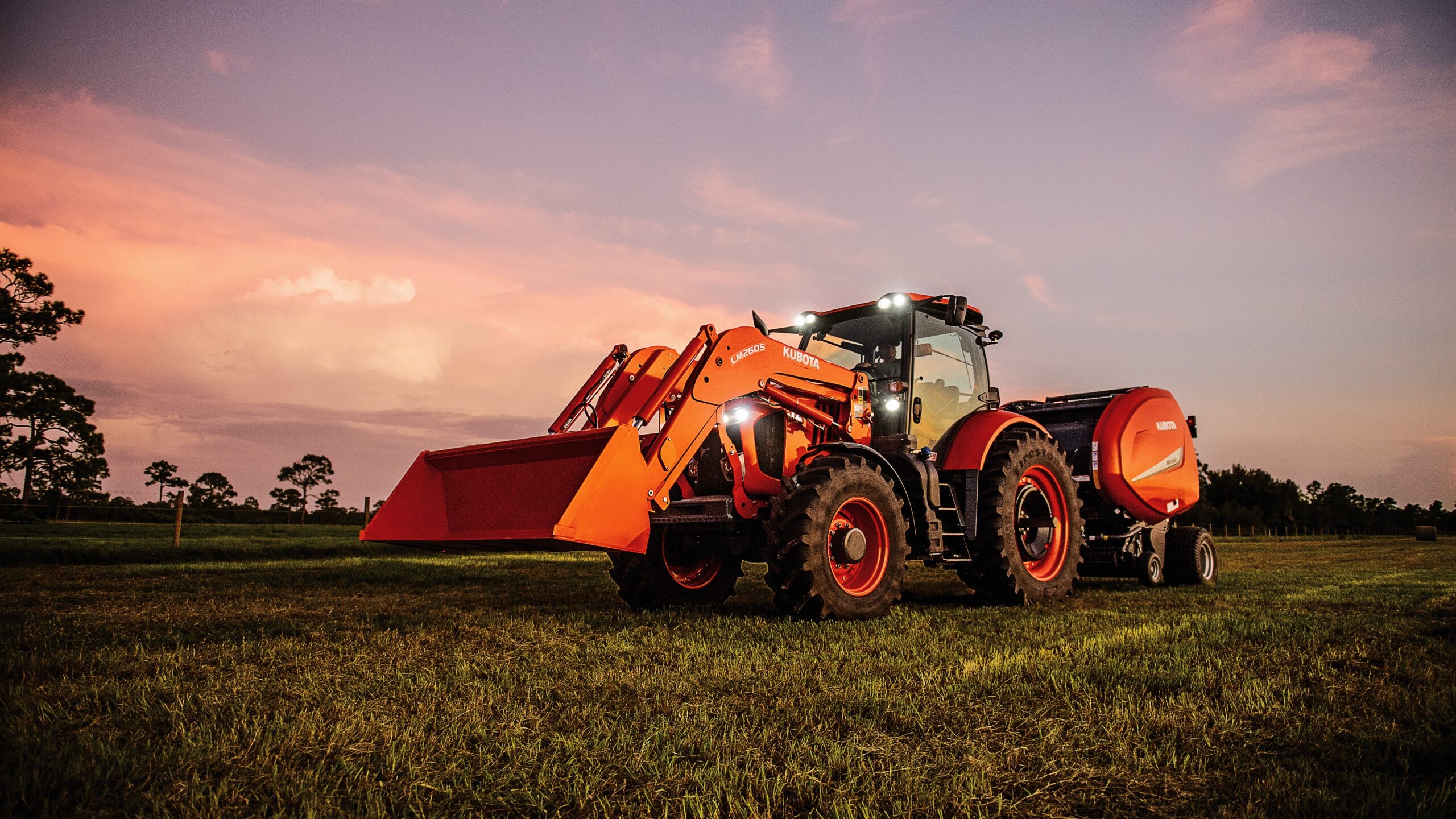 Kubota M7 tractor working long hours in the field